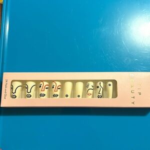 TIP Beauty Press On Nails - white w/ face designs.